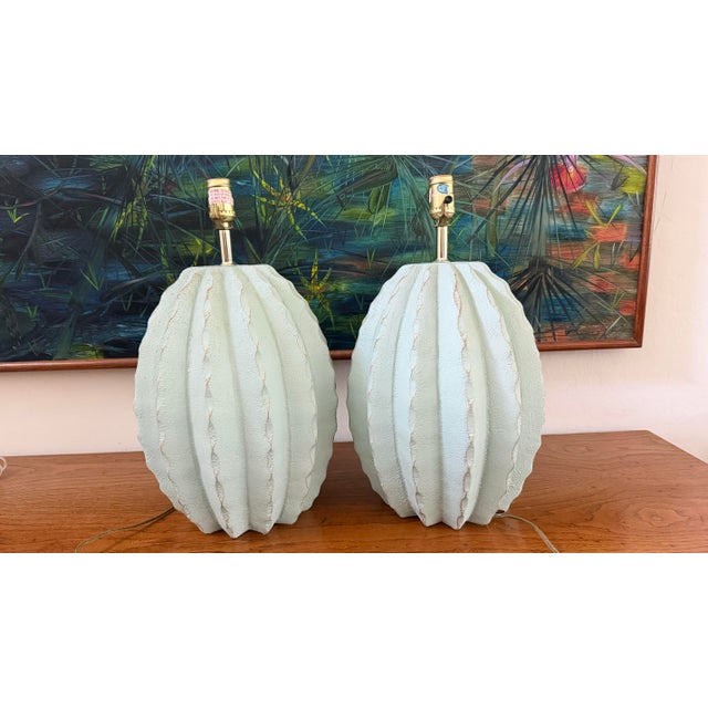 Pair of sculptural ribbed table lamps by Alsy, featuring an organic cactus-inspired form with deeply carved vertical...