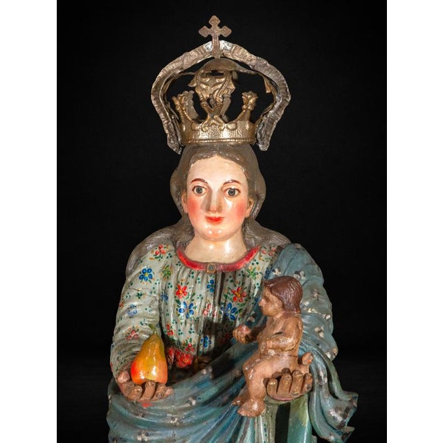 This finely carved and richly polychromed sculpture represents the Virgin of the Martyrs (Virgen de los Mártires de la...