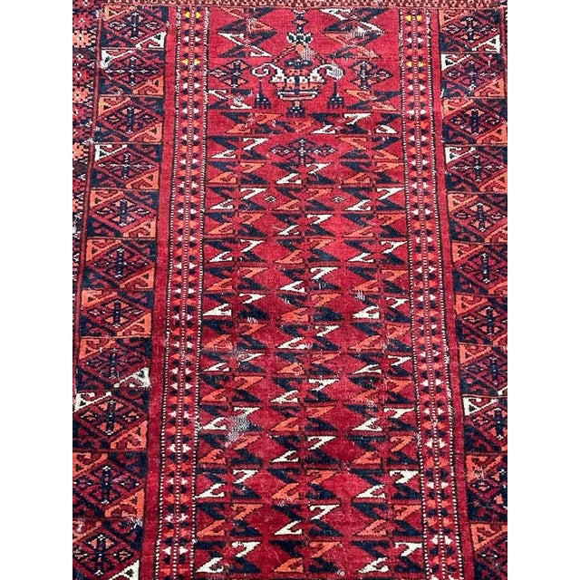 Pretty antique tribal Turkmen rug with nice unusual design with at the top, the design of two constructions and...