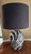 This one-of-a-kind vintage table lamp is a true showstopper. Featuring hand-painted black and white detailing and a...