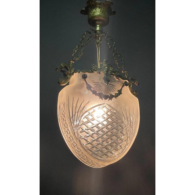 Rare ceiling lamp in the form of a jewelry pendant. France around 1900. “Belle Epoque” bronze and cut glass. A light...