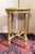 Round gilt wood side table, Louis XVI style, circa 1880. Made of carved wood with a veined white marble top. Four tapered...