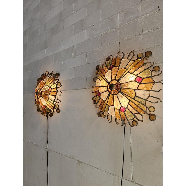 An exceptional and highly decorative set of wall lamps designed by Albano Poli for Poliarte, Italy. These striking pieces...