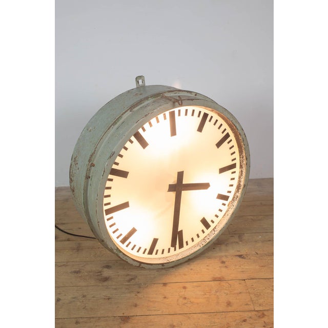 Large station clock with three integrated lights. The clock has been fully restored with respect for its original...