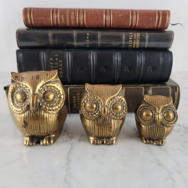 A fabulous family trio of mid-century modern solid brass owls. These detailed and heavy weighted owls were made by Leonard...