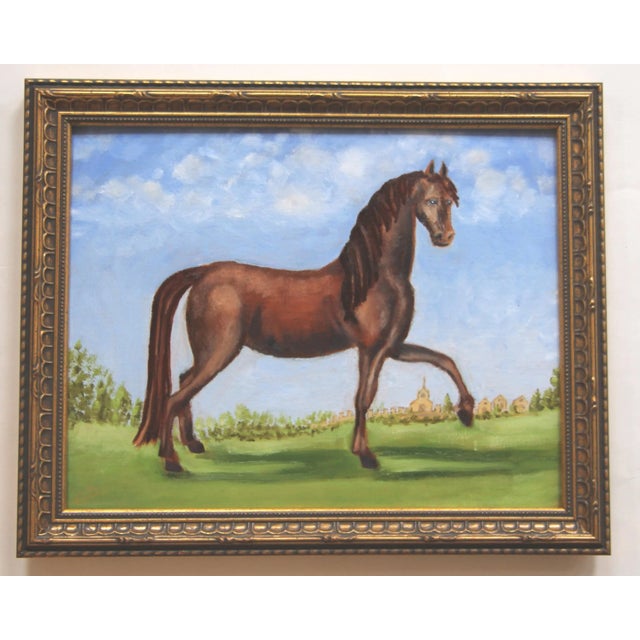 An elegant chestnut horse, this equine figure is set in an open field landscape with a mountainous background with...