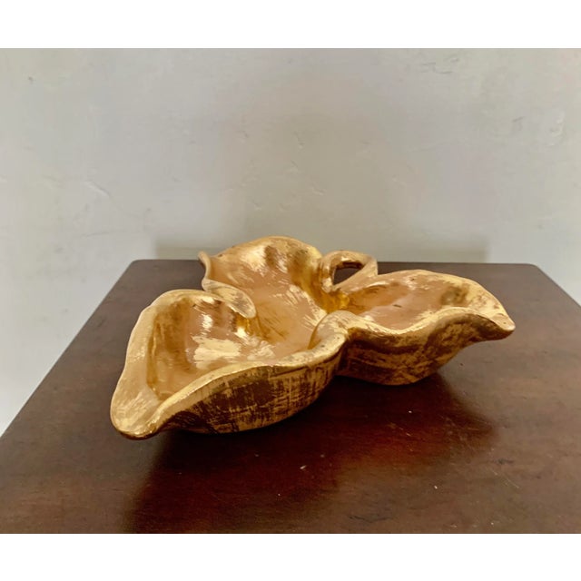 Perfect as a serving bowl for nuts or olives, this vintage Stangl gilt ceramic bowl is a great addition to any decor!...