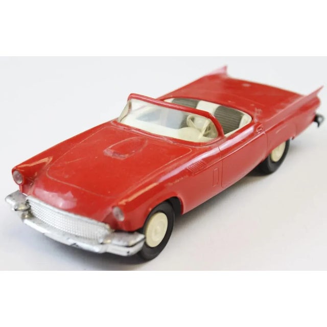1957 Ford Red Thunderbird Convertible. Dimensions: 7"L x 2 3/4"W x 1 5/8"H