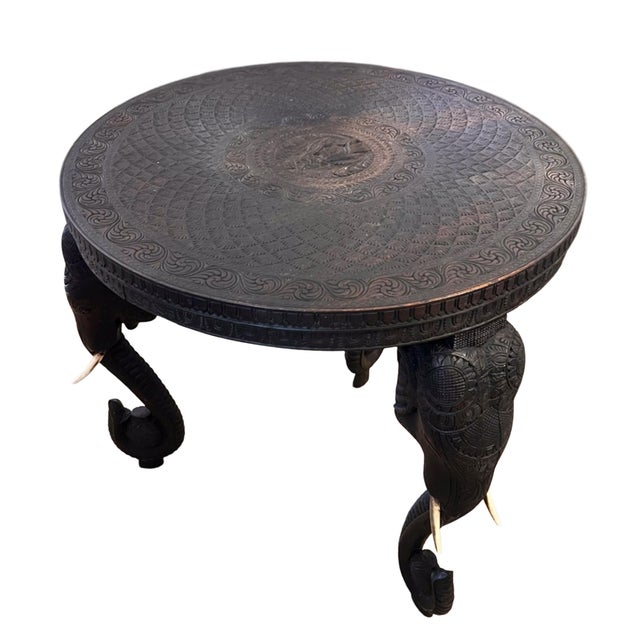 This decorative table was made in India in the early 20th century. Please take a look at all our pictures to see the...