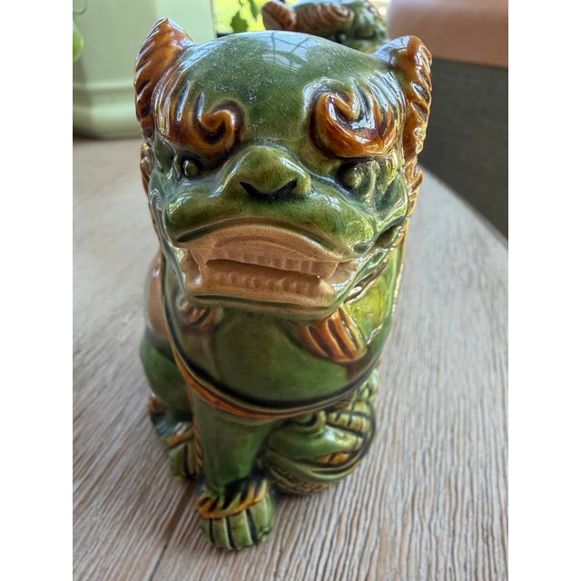 This fabulous pair of petite green glazed bisque porcelain foo dogs is perfect for a bookshelf or tabletop. Measuring 4.5"...