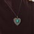 This extraordinary Victorian heart pendant necklace is a richly detailed jewel from the 1880’s, centered by an oval cut...