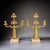 Elegant pair of French gilt bronze candelabras from the early 20th century, designed for two candles each and executed in...