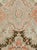 An antique Russian Karabagh rug from the first quarter of the 20th century featuring tones of coral, browns and light...