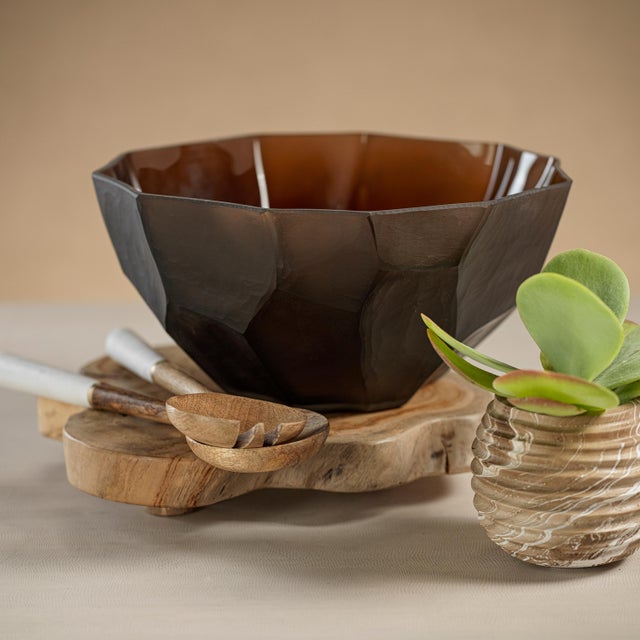 This uniquely textured bowl sports a dark faceted and geometric cut pattern that invites a warm earthy feeling to your...