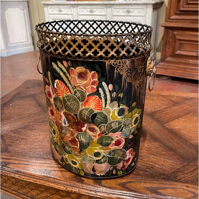 Place this colorful antique stand in a powder room. Crafted in France circa 1960 and oval in shape, the metal basket...