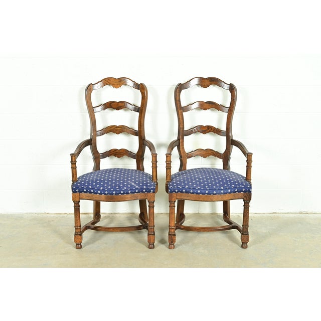 A gorgeous pair of French Country, French Provincial, or William and Mary style armchairs or dining captain chairs By...