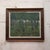 20th Century French Tree Line Painting depicts a quiet woodland scene with a row of slender trees rising through a deep...