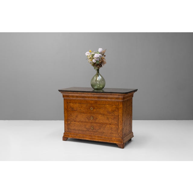 French Louis Philippe style commode in elm with original marble top. Circa 1870.