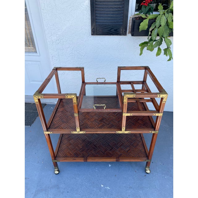 A beautifully crafted vintage bar cart from Georgian Furnishing Company featuring rich wood tones, intricate parquet...