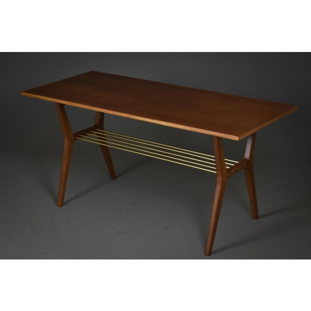 A rare rockabilly coffee table from the 1960s, distinguished by its dynamic form and elegant proportions. The table...