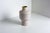 Medium Tribe Vase by Arik Levy George for Bitossi, 2007 Unglazed White exterior with inside yellow interior The sharp...