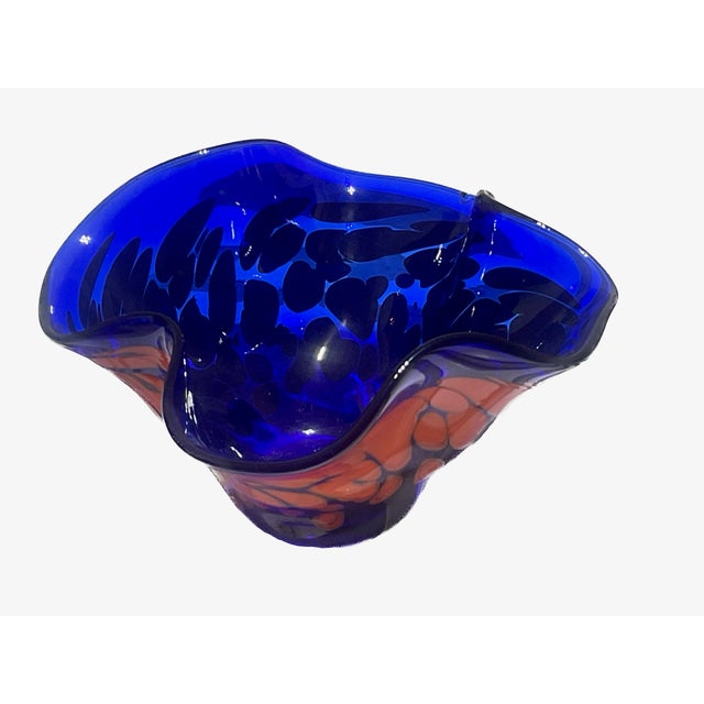 This striking hand-blown studio glass handkerchief vase was created in 2012 by Somewhere Glass. This piece features a...