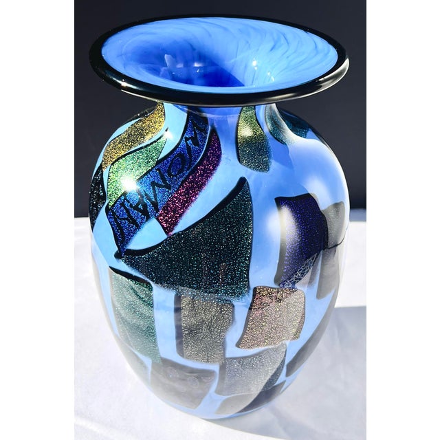 A striking hand-blown studio art glass vase by MAD Art Studios in San Diego, California. This sculptural vase in luminous...