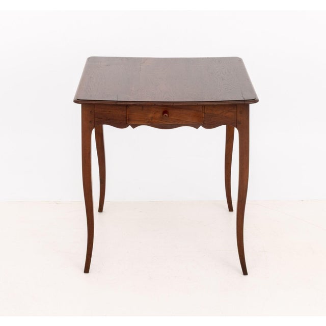 French Provincial Style Oak Lamp Table, with two drawers above cabriole legs. 27" H x 25.5" W x 28.25" D. Provenance: An...