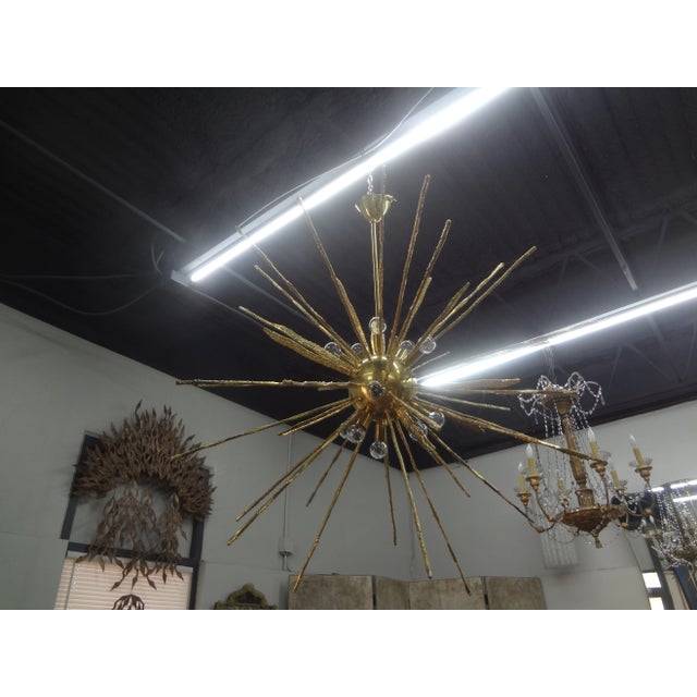 Monumental Pair Of Italian Modern Hammered Brass Sputnik Chandeliers. This outstanding pair of Italian hand-hammered brass...