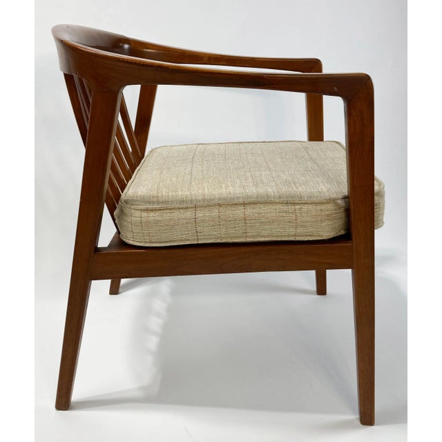 MCM mid century modern arm chair in the style of Folke Ohlsson For Dux (Unmarked). Features rich teak curved wood frame...