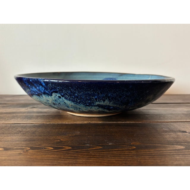 Vintage studio pottery bowl, glazed in deep blues and browns. Signed by the artist. Most items found at Pub & Oasis are...