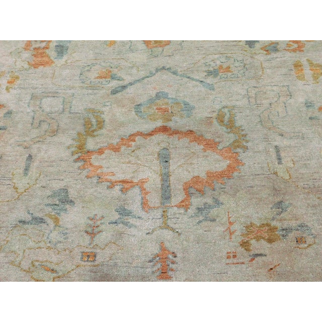 Origin: India Size: 8’3” x 9’9" Design: Oushak Material: Wool Primary Color: Beige Secondary Color: Tangerine Description:...
