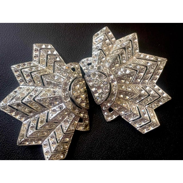 Art deco, 1930s starburst or sunburst chevron clip mates by Polcini. Marked with a small 5-pointed star stamped directly...