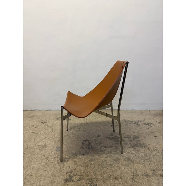Set of four Lyo dining chair with sling leather seats attached to a chrome base with four legs designed by Gordon...