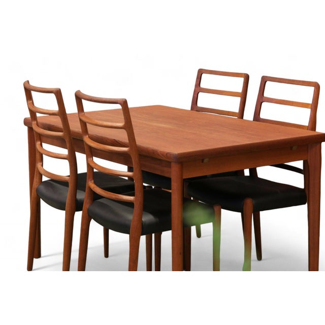 Teak dining table designed by Brdr. Furbo Spottrup in Denmark. The dining table has sturdy extendable leaves that are...