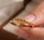 Embrace a warm, sun-kissed glow with this striking citrine bypass ring. This contemporary piece features a sleek, polished...