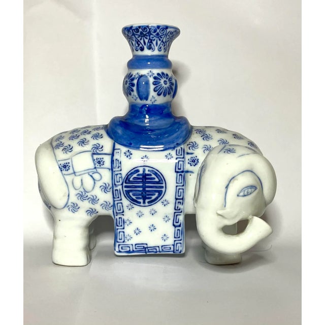 Darling 1930s Chinoiserie Candle Sticks with mirror image elephants turning their head. These are hand painted and high...