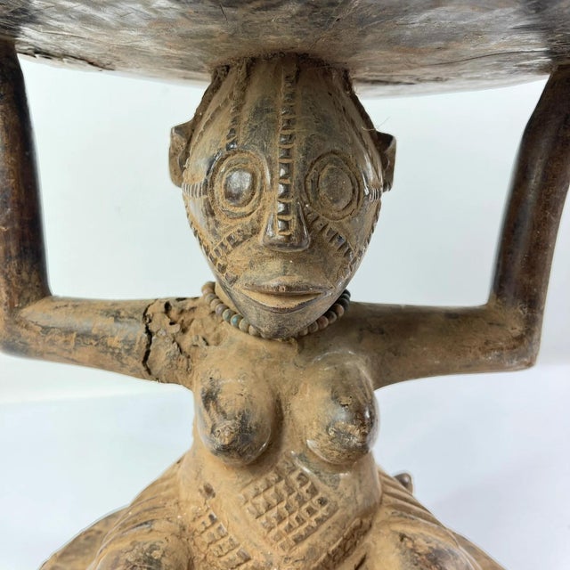 The Tabwa Figural Stool, originating from the Democratic Republic of Congo, stands as a striking example of the Tabwa...