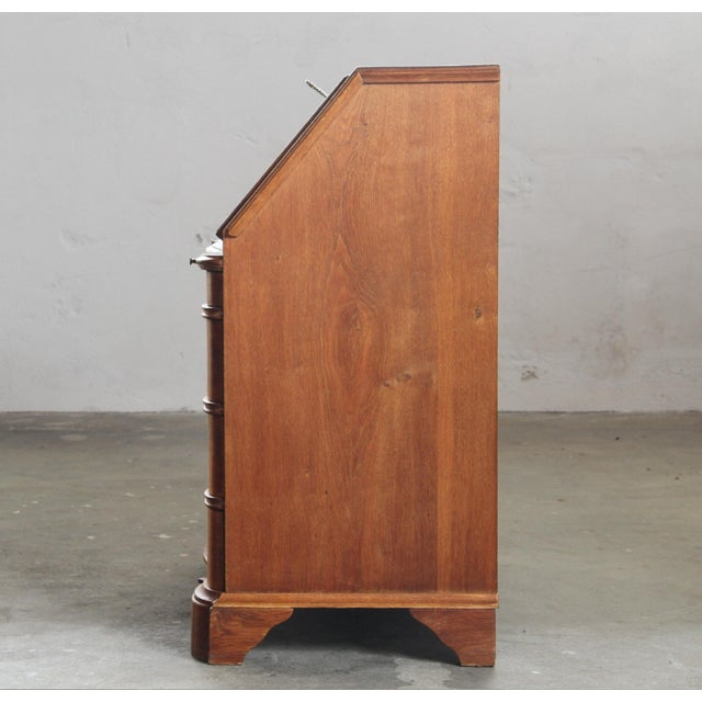 A striking example of early 20th-century historicist design, this substantial secretary bureau captures the architectural...