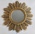 A stunning vintage sunburst mirror, circa 1970s. This mirror is made of resin and has lovely alternating rays with...