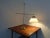 This is an adjustable table lamp from Le Klint from the 1960s. The model is Model 319. Under the stand is the maker's...