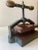 Antique, 19th century book press. Made of brass , cast iron, and wood. Purchased by current owner in 2005 from a...