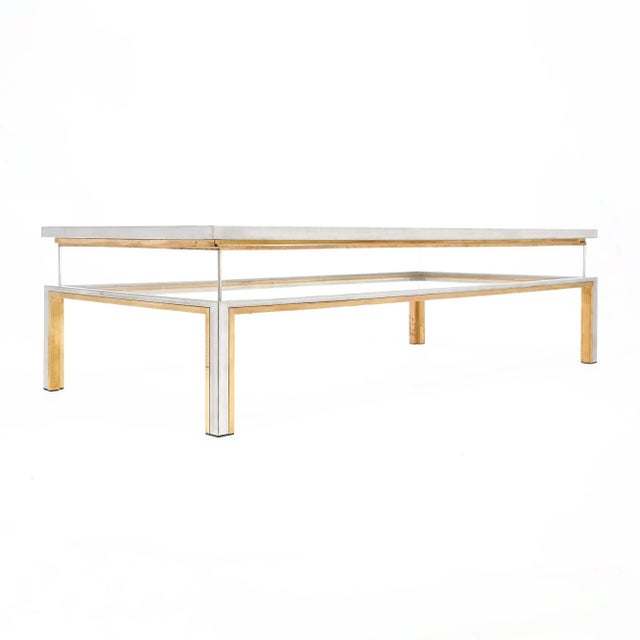Coffee table, French, in the Modernist style by Maison Charles. The iconic coffee table features a lucite incase...