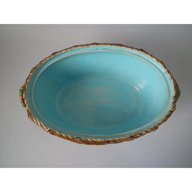 Minton Majolica game pie dish which features a hare, mallard and blackbird on a bed of fern and oak leaves. Colouration:...