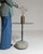 Round stone-base side table in Deep Charcoal Grey. Finished in deep charcoal grey, this round stone-base side table is...