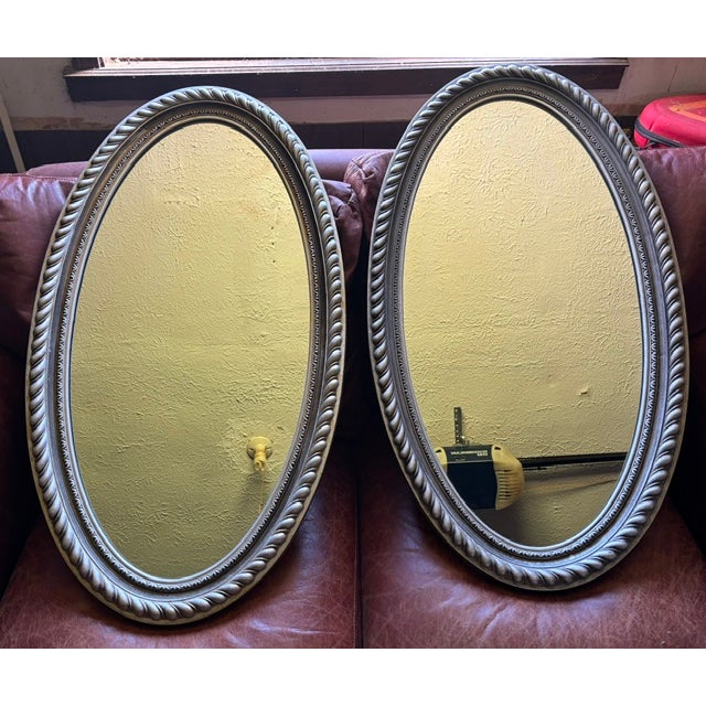 Large 1978 Brock-McVey oval mirror set. 35Hx19.5W Distressed pewter composite finished frames, no chips, scratches or cracks.