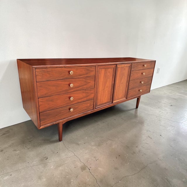 Presented is a vintage Mid-Century Modern “Declaration” dresser by Kipp Stewart for Drexel. Crafted from rich walnut, this...