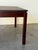 Danish Mid-Century Modern coffee table crafted in richly grained rosewood. This piece features a clean square silhouette...