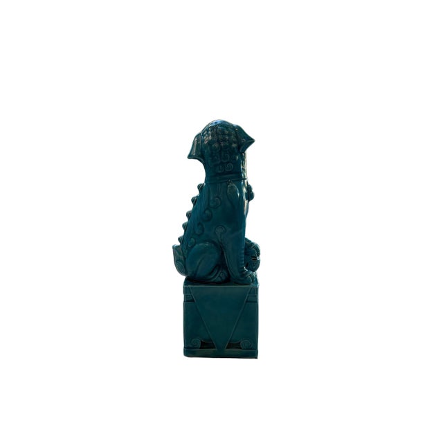 A striking vintage male Foo Dog, traditionally symbolic of protection and prosperity in Chinese aesthetics. This hand-...
