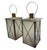 A striking and elegant pair of large-scale hurricane lanterns, beautifully crafted in a timeless Neoclassical design....